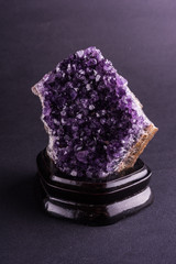 Amethyst geode on black background. Beautiful natural crystals gemstone.
