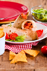 Tortilla wraps with chicken and vegetable. 