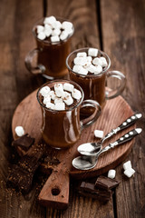 hot chocolate dessert with marshmallows on wooden background