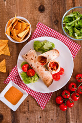 Tortilla wraps with chicken and vegetable. 