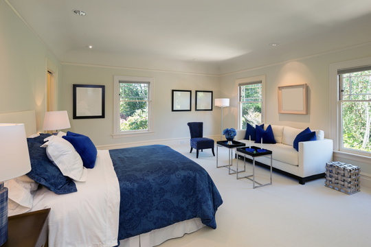 Amazing bedroom with blue decoration in luxury home with copy space.