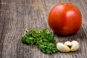 Tomatoes,garlic and parsley in natural light