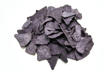 Group of blue corn tortilla chips on white background. Horizontal