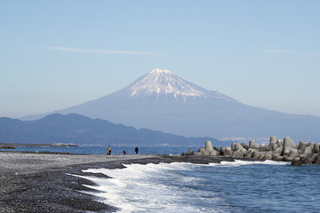 Stunning view of Fuji mountain from Miho no Matsubara Beach,Shizuoka,Japan, in soft blue sky with Haze and smoke effect at the mountain.
