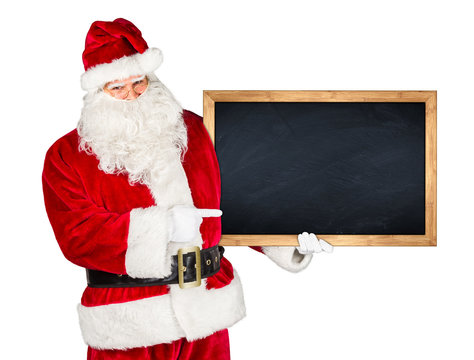 Santa claus holding empty blackboard with wooden frame and pointing with his finger on it isolated on white background / weihnachtsmann nikolaus mit leerer Tafel isoliert