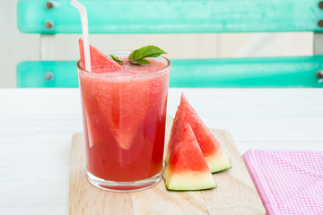 red water melon in glass on food table