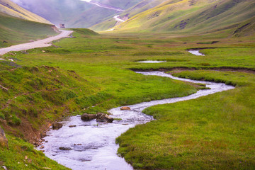 Pasture on the hill in autumn at countryside of Kunming, yunnan province China. (With blur foreground and mist, haze, smoke effect at background)