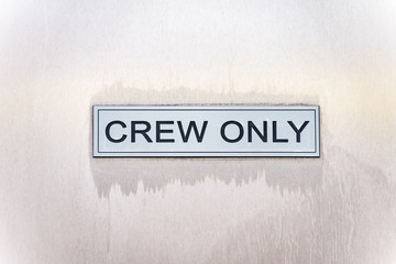 Area for staff, Crew only sign on a ship - 127258717