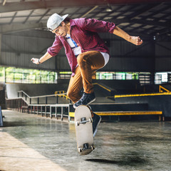 Boy Skateboarding Jump Lifestyle Hipster Concept