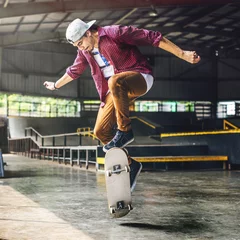 Zelfklevend Fotobehang Boy Skateboarding Jump Lifestyle Hipster Concept © Rawpixel.com