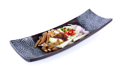 green mango spicy salad with crispy fish on wooden plate