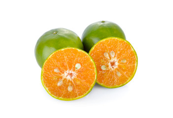 whole and half cut orange on white background