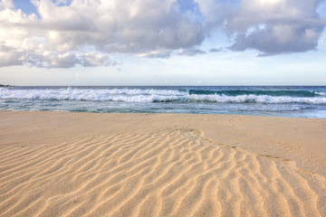 Fototapeta na wymiar Ripples in sand on tropical beach