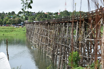 Travel landscape: Mon wooden bridge against blue sky at Sangklaburi, Thailand