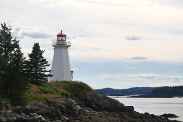 The lightstation (light house now museum) at Green’s Point, is octagonal wooden tower established in 1879 and altered in 1903 to direct boats and ships traffic trough LEtete Passage Bay of Fundy.