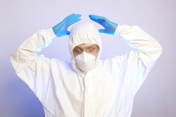 Male professional in hooded suit for bio-hazard protection