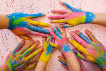 Hands painted in different colors. Concept of love, friendship, happiness in family. 