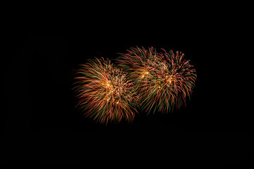 Fototapeta premium Fireworks in the night.New Year celebration fireworks,Colorful fireworks over dark sky, displayed during a celebration event