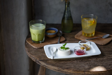 Dessert panna cotta with fresh berries on wooden background, selective focus.Traditional Italian dessert. Valentines Day background