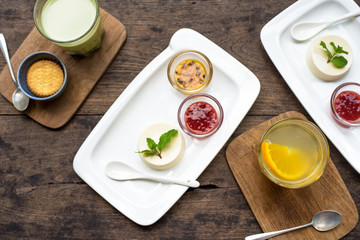 Dessert panna cotta with fresh berries on wooden background, selective focus.Traditional Italian dessert. Valentines Day background