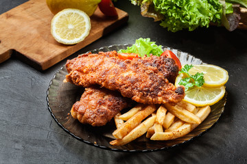 Fried fish in crispy batter with chips