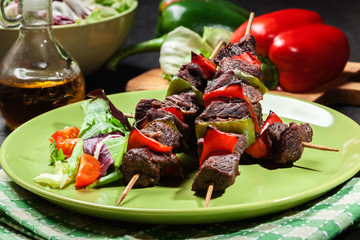 Grilled beef meat and vegetable kebabs