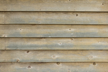 Obraz premium Weathered wood siding for use as background.