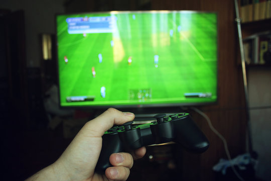 Playing football with the joystick on the game console