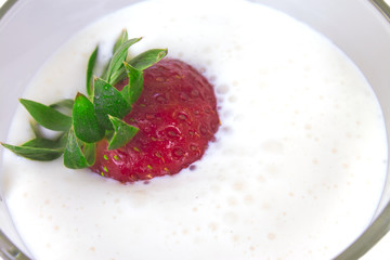 ripe strawberries in a thick sweet yogurt