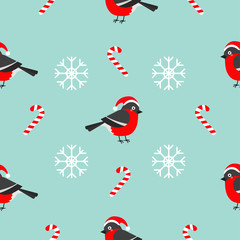 Christmas bullfinch bird wearing red santa hat, snowflake, candy cane. Seamless Pattern Decoration. Wrapping paper, textile template. Blue background. Flat design.