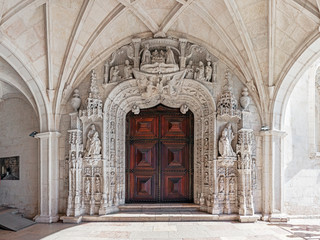 Fototapeta na wymiar South Portal of the Jeronimos Monastery in Lisbon, Portugal. A UNESCO World Heritage Site it stands as the best example of the Manueline art.