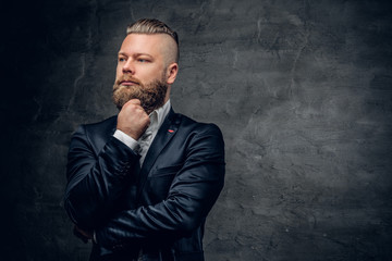 Bearded hipster male in purple suit.