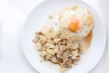 Fried cauliflower with pork, fried eggs with rice in white dish isolate on white background, Thai style food