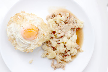 Fried cauliflower with pork, fried eggs with rice in white dish isolate on white background, Thai style food