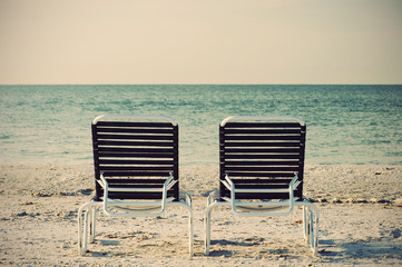 Two Beach Chairs in front of ocean, retro style
