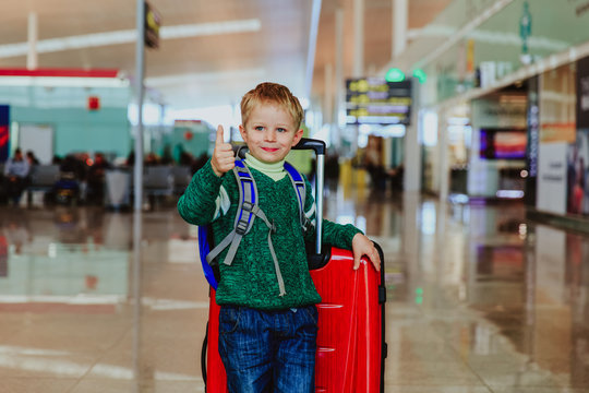 little boy loves travel in the airport