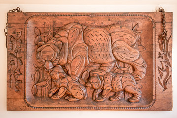 Picture carved in wood with bears