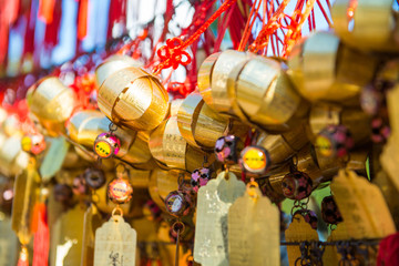 Golden bell at Wong Tai Sin Temple people wish and hang it on ro - obrazy, fototapety, plakaty
