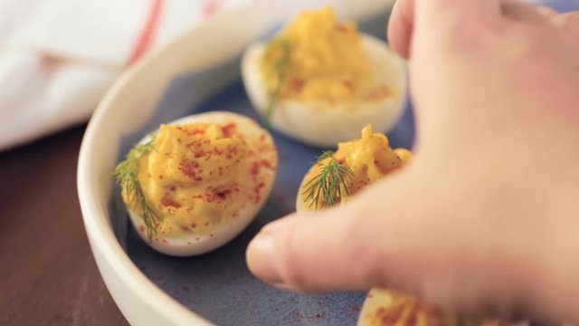 Deviled eggs garnished with fresh dill