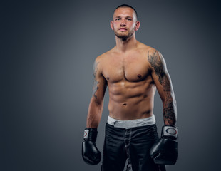 Fototapeta na wymiar Brutal extreme fighter with tattoo on arms