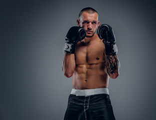 Obraz premium Brutal extreme fighter with tattoo on arms