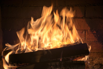 burning firewood in a fireplace