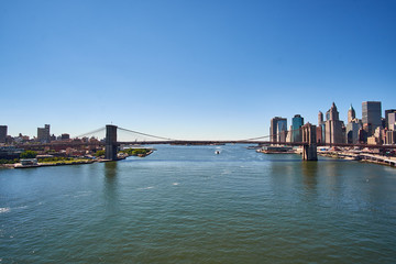 Fototapeta na wymiar NEW YORK CITY - SEPTEMBER 25: Looking down East River from Manhattan Bridge with Brooklyn and Downtown skyline in the background