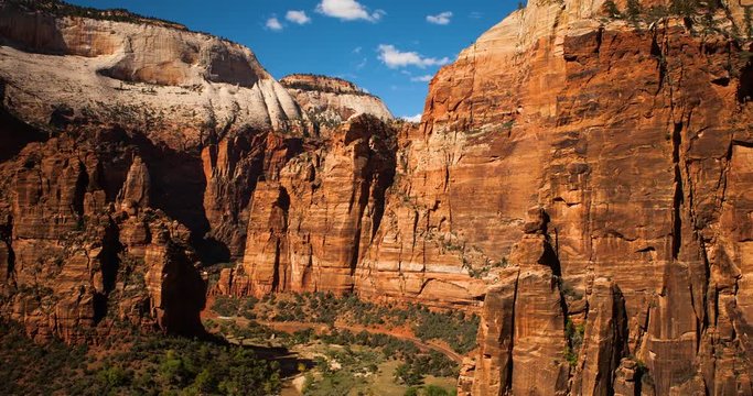Zion National Park, Utah, USA - view at Zion Canyon Scenic Drive in the valley with Shuttlebus at sunny day with blue sky - Timelapse with pan left to right