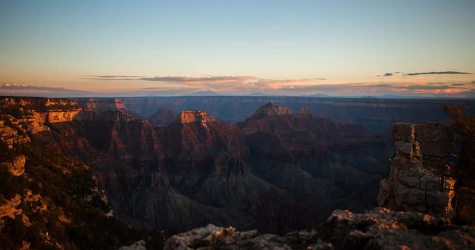 Grand Canyon National Park, Arizona, USA - view near Bright Angel Point at North Rim with red and orange rocks at sunset - Timelapse with zoom in 