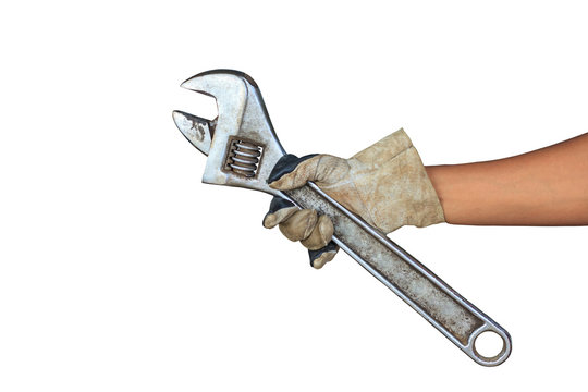 Male hand holding the adjustable spanner.