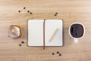 cupcakes notebook tiramisu homemade cakes coffee dessert coffee on a wooden background dark light pink gentle cream breakfast