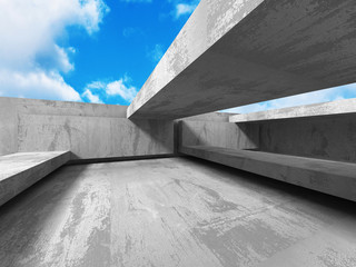 Concrete abstract architecture on cloudy sky background