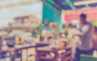 blur image of coffee shop with bokeh .