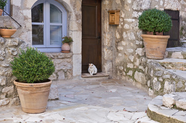 Small patio with flowers in the old village Gourdon